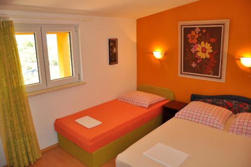 Postel nebo postele na pokoji v ubytování Apartments Villa Annika