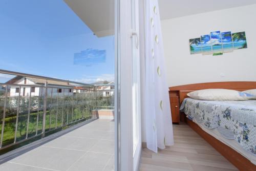 Postel nebo postele na pokoji v ubytování Apartments & Rooms Seaside