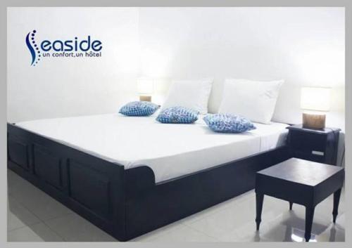Hôtel Seasideにあるベッド