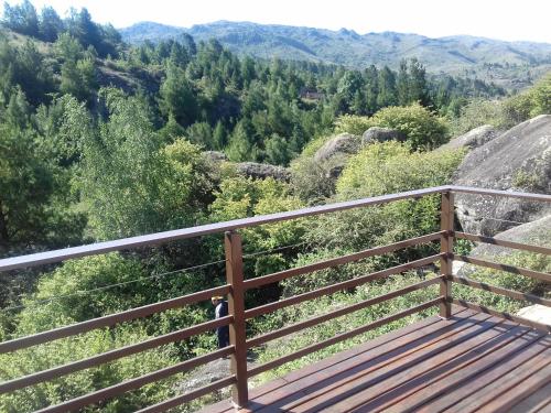 a balcony with a view of the mountains at Casa en La Cumbrecita in La Cumbrecita