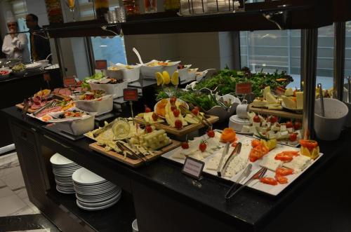 a buffet with many different types of food on display at B Business Hotel & Spa in Antalya