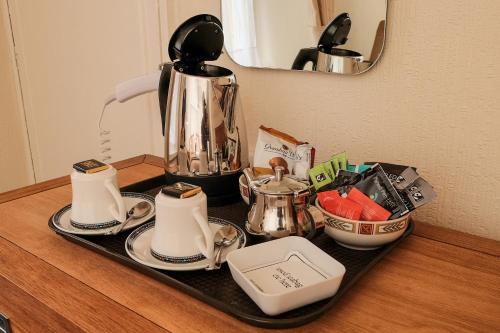 a tray with a tea set on top of a table at Ivy House B&B in Dolgellau