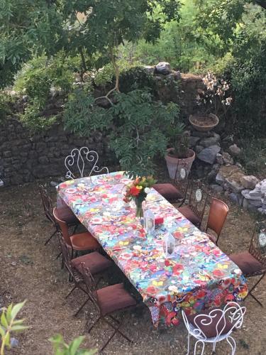 a table with a flowered table cloth on it at Fort de la Bastide in Uzer