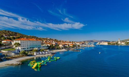 a river with a bunch of boats in the water at Apartment Patricia in Trogir