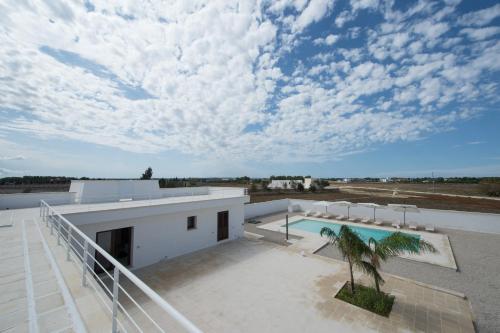 a house with a swimming pool on top of a roof at Villa Lupia in Cutrofiano
