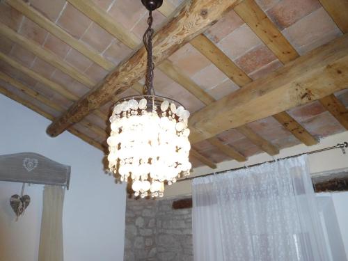 a chandelier hanging from a ceiling in a room at Fra Bosco e Cielo B&B in Mercato Saraceno