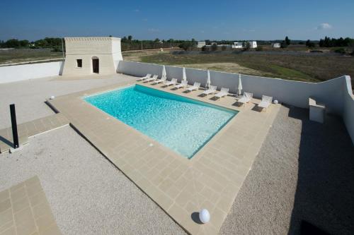 a swimming pool on the roof of a house at Villa Lupia in Cutrofiano
