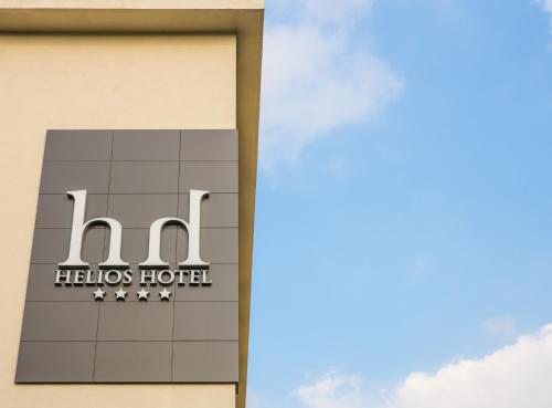a sign on the side of a hilton hotel at Helios Hotel in Monza
