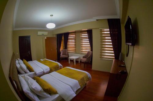 Postel nebo postele na pokoji v ubytování Ramparts Hotel