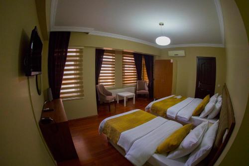 Postel nebo postele na pokoji v ubytování Ramparts Hotel