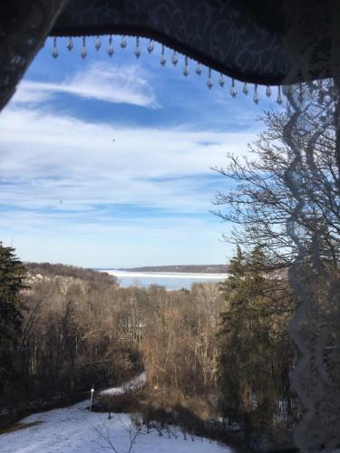 a view of a lake from a window at Renwick Clifton House B&B in Saugerties
