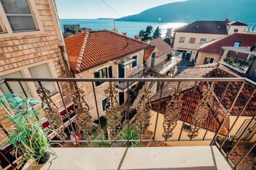 a balcony with a view of a city at Apartments Master 5 in Herceg-Novi