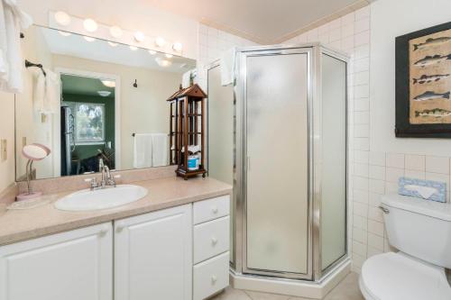 a bathroom with a shower and a sink and a toilet at Left Coast Lodge - Pet Friendly in Sisters