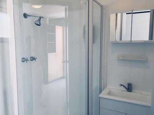 a bathroom with a shower and a sink at Coonawarra Ensuite Unit C in Coonawarra