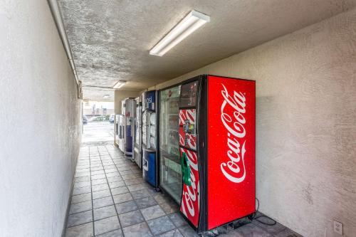 a cocacola vending machines are lined up against a wall at Motel 6-El Paso, TX - East in El Paso