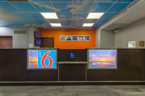 a waiting room with a number sign on the wall at Motel 6-Atlanta, GA - Atlanta Airport in Atlanta