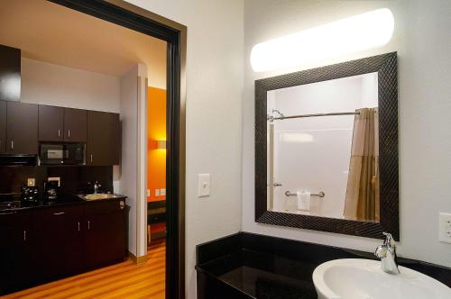 a bathroom with a sink and a mirror at Motel 6-Midland, TX in Midland