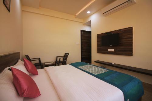 Voodi või voodid majutusasutuse Hotel Vraj Inn toas