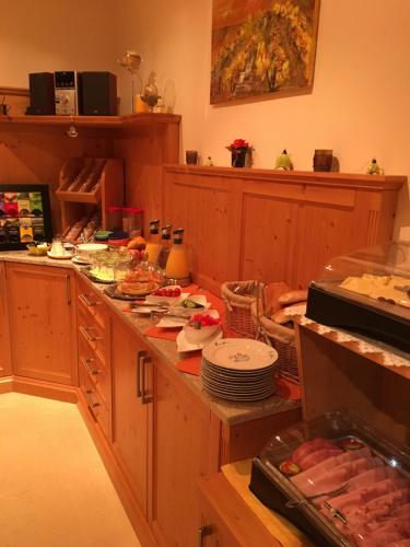 a kitchen with a counter with food on it at Frühstückspension Kuzmic in Wartberg