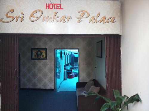a hotel winter palace sign in a living room at Dwivedi Hotels Sri Omkar Palace in Varanasi