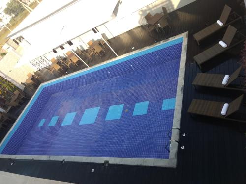 a large blue screen on the side of a building at Bigstay in Tada