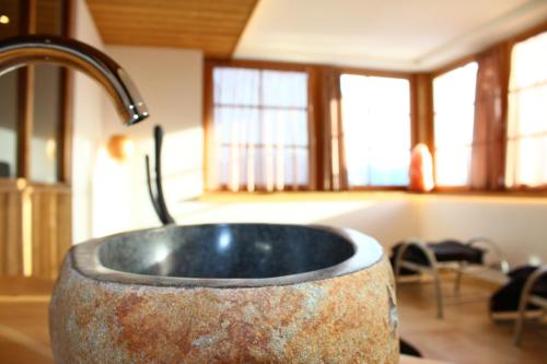 a stone sink in a kitchen with a sink at Gasthaus Bad Siess in Longomoso