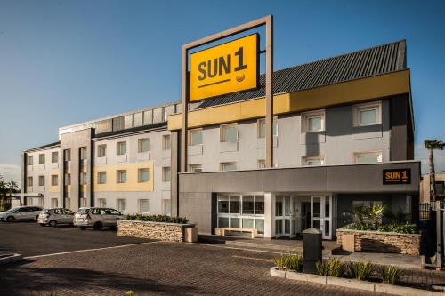 a building with a sunil sign on the side of it at SUN1 MILNERTON in Cape Town