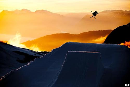 a skier in the air over a snow covered mountain at Trolltunga/Folgefonna Camp house in Jondal