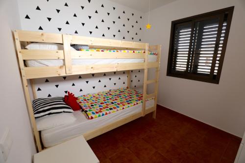 Postel nebo postele na pokoji v ubytování Casa Be