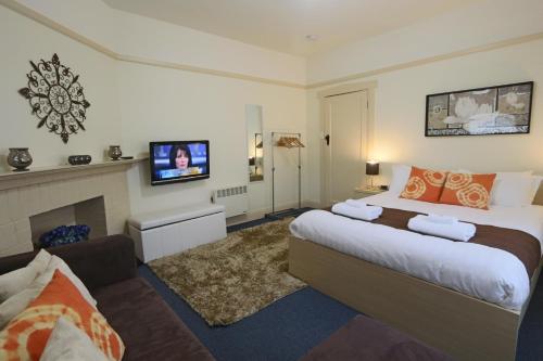 Ένα ή περισσότερα κρεβάτια σε δωμάτιο στο Moonah Central Apartments