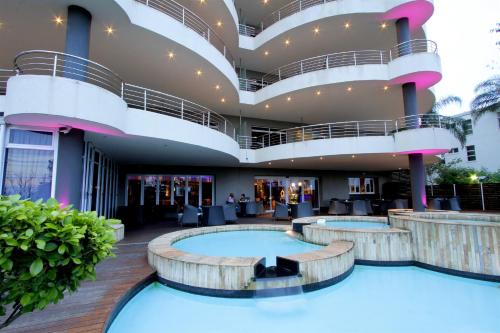 a hotel lobby with two hot tubs at Coastlands Musgrave Hotel in Durban