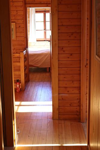 an open door to a room with a bed at Magnifique chalet pour 10 personnes à Vercorin in Vercorin