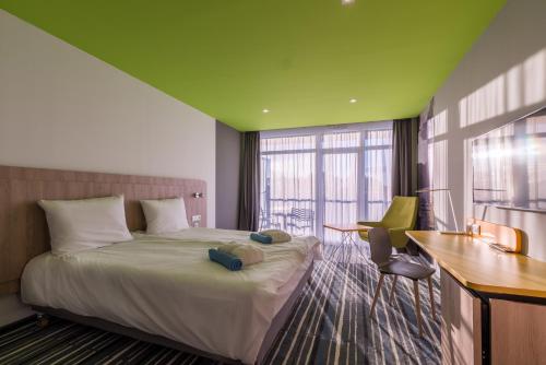 Postel nebo postele na pokoji v ubytování Park Inn By Radisson Zalakaros Hotel & Spa
