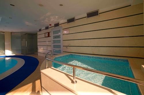 a swimming pool in the middle of a building at Radisson Hotel President Old Town Istanbul in Istanbul
