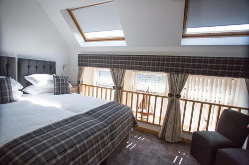 Postel nebo postele na pokoji v ubytování By The Bay