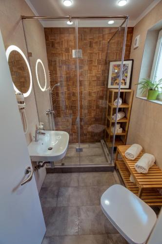 a bathroom with a shower and a sink at First Hostel in Bucharest