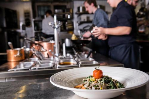 a plate of food on a counter in a kitchen at Hotel Stern Chur in Chur