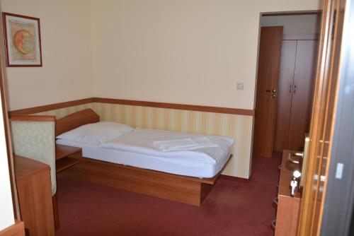 Postel nebo postele na pokoji v ubytování Penzion na Potočnej