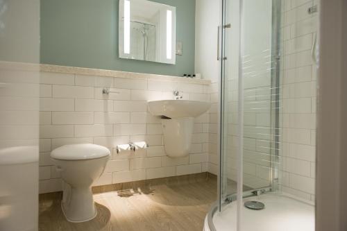 a bathroom with a toilet and a sink and a shower at Balloch House by Innkeeper's Collection in Balloch