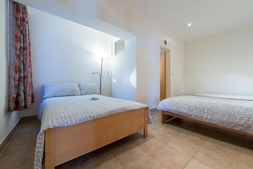 Ένα ή περισσότερα κρεβάτια σε δωμάτιο στο Apartment Fortuna