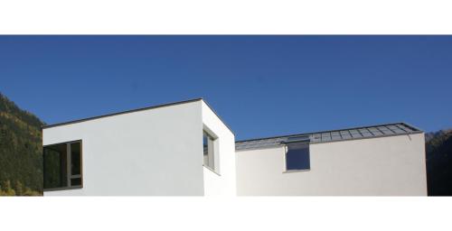 a house with a solar panel on the side of it at Laudinella - Apart in See