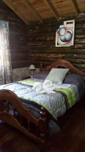 Tempat tidur dalam kamar di Refugio de las Sierras