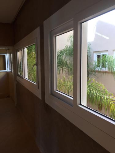 two windows in a room with a view at Europa mirlef t aventur Guest House in Mirleft