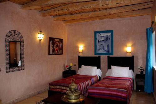 En eller flere senger på et rom på La Kasbah d'Ouzoud