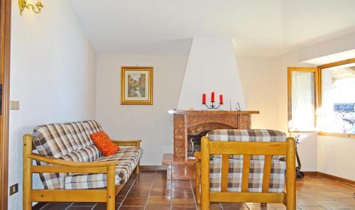 a living room with a couch and a fireplace at Casa del Borgo Olga by Gardadomusmea in Tremosine Sul Garda