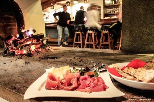 a plate of food on a counter with a plate of food at Hotel Savoia dal 1924 in San Martino di Castrozza