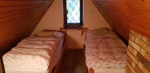 Postel nebo postele na pokoji v ubytování Krpáčovo, Nízke Tatry - chata na kraji lesa