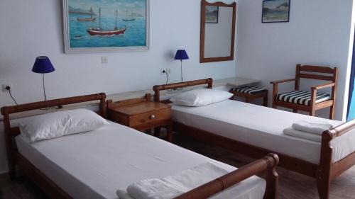 Ένα ή περισσότερα κρεβάτια σε δωμάτιο στο Kavos Bay Apartments Elounda