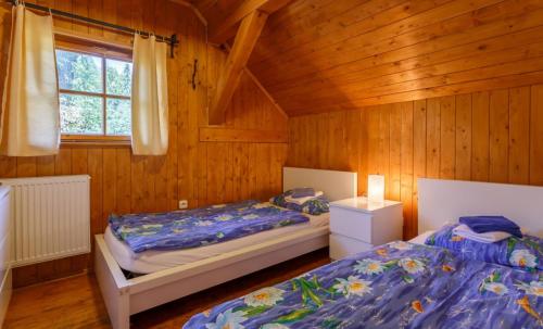 A bed or beds in a room at X-Park Františkov