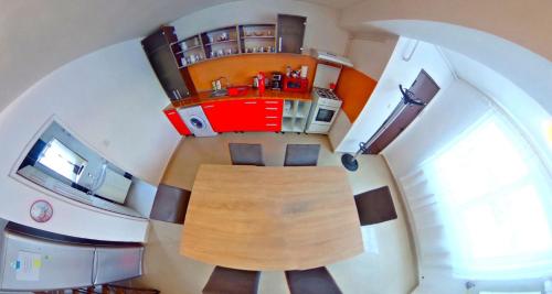 an overhead view of a kitchen and a living room at Csikos Apartment in Cluj-Napoca